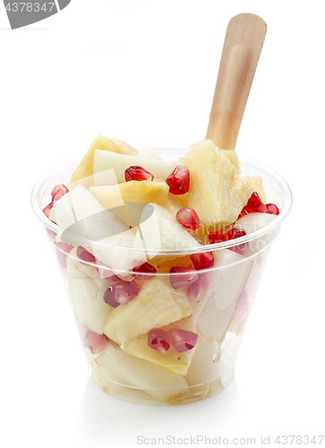 Image of fresh fruit pieces salad in plastic cup