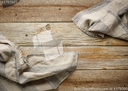 Image of linen napkin on wooden background