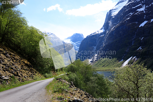 Image of The narrow and winding road leads into the glacier in Loen, Stry