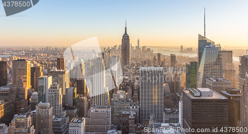 Image of New York City skyline with urban skyscrapers at sunset, USA.