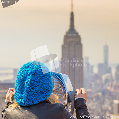 Image of Woman enjoying in New York City panoramic view.