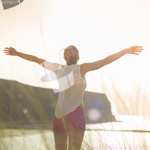 Image of Free Happy Woman Enjoying Sun on Vacations.