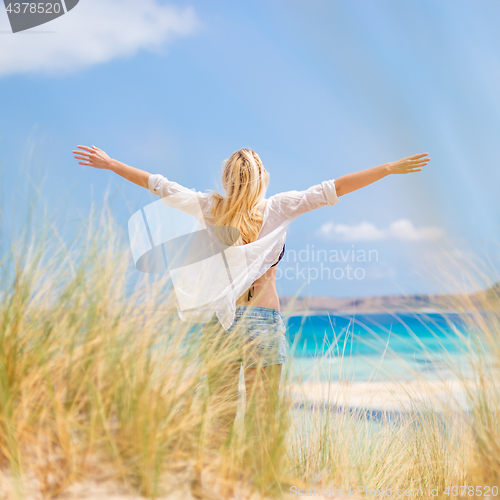 Image of Free Happy Woman Enjoying Sun on Vacations.