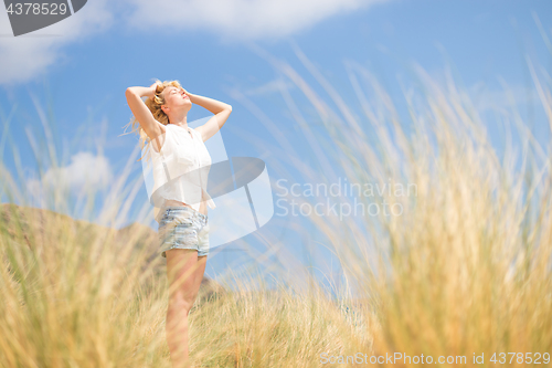 Image of Free Happy Woman Enjoying Sun on Vacations.