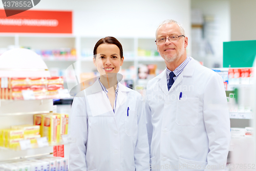 Image of happy apothecaries at pharmacy