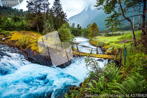 Image of Suspension bridge over the mountain river, Norway.