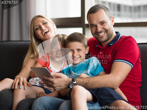 Image of young cuple spending time with kids