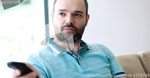 Image of Happy Man Watching Television