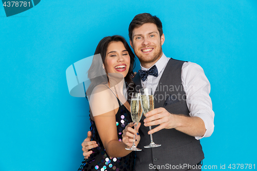 Image of happy couple with champagne glasses at party