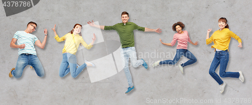 Image of happy people or friends jumping in air over gray