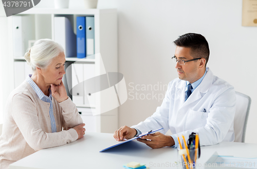 Image of senior woman and doctor meeting at hospital