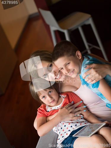 Image of Young Family Using A Tablet To Make Future Plans