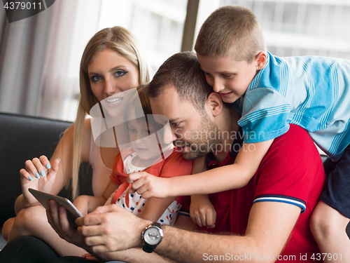 Image of young cuple spending time with kids