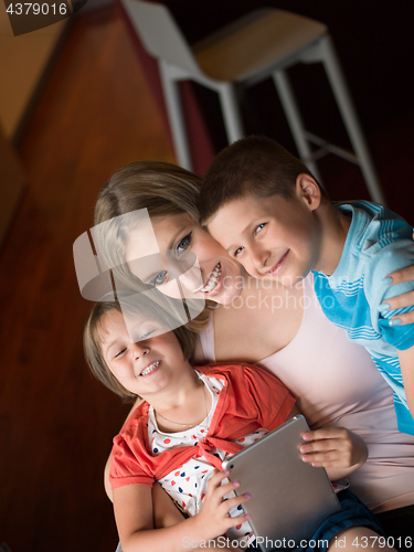 Image of Young Family Using A Tablet To Make Future Plans