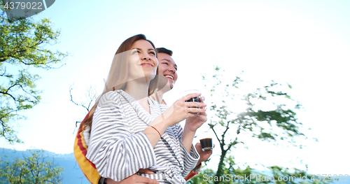 Image of drinking coffee on terrace of villa in the morning