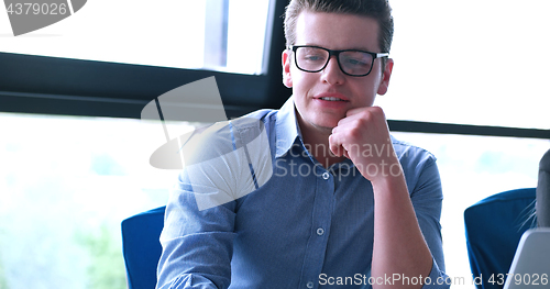 Image of young businessman in startup office