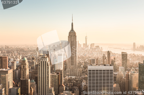 Image of New York City skyline with urban skyscrapers at sunset, USA.