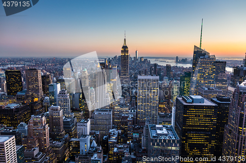 Image of New York City skyline with urban skyscrapers at dusk, USA.