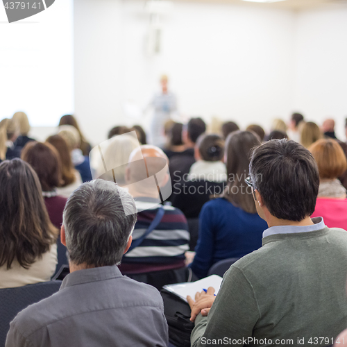 Image of Woman giving presentation on business conference.