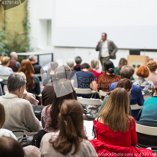 Image of Man giving presentation in lecture hall at university.