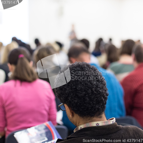 Image of Woman giving presentation on business conference.