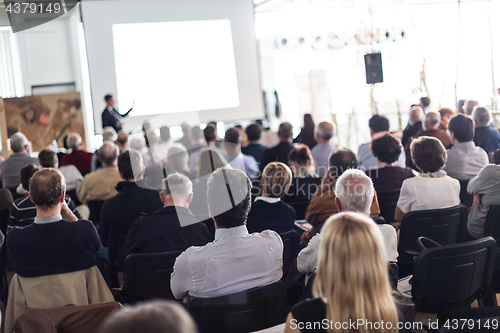 Image of Business speaker giving a talk at business conference event.