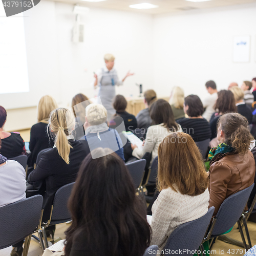 Image of Woman giving presentation on business conference.