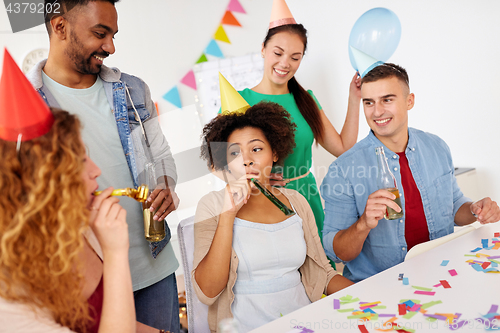 Image of happy team having fun at office party