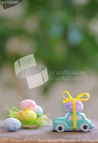 Image of Toy car carrying easter eggs