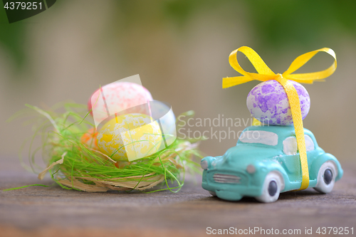 Image of Toy car carrying easter eggs