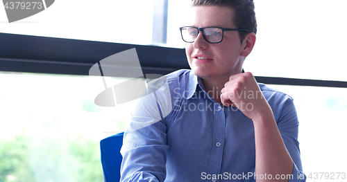 Image of young businessman in startup office