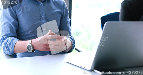 Image of young businessman in startup office