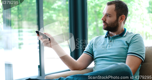 Image of Happy Man Watching Television