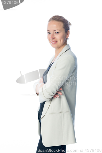 Image of Business woman standing with arms crossed against white background.