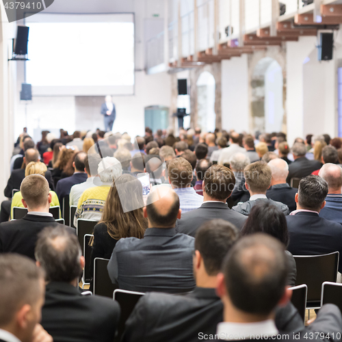 Image of Business speaker giving a talk at business conference event.