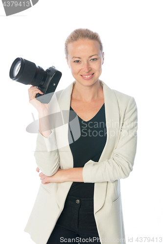 Image of Woman photographer takes images with dslr camera