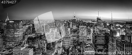 Image of New York City skyline with urban skyscrapers at dusk, USA.