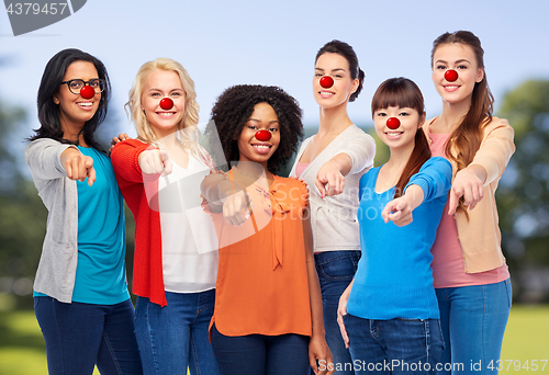 Image of group of women pointing finger at red nose day