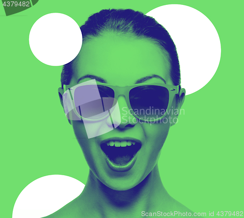 Image of happy amazed teenage girl in sunglasses