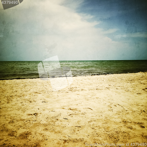 Image of Retro image of gloomy sea and beach