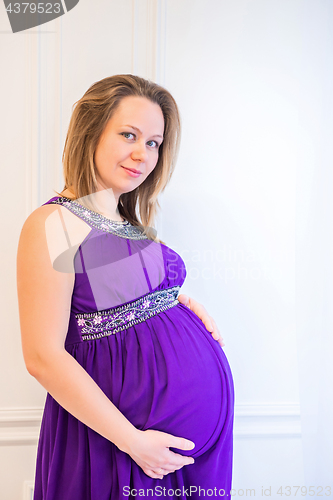 Image of Beautiful pregnant woman standing