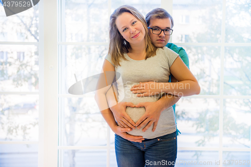 Image of Beautiful couple: pregnant woman and man