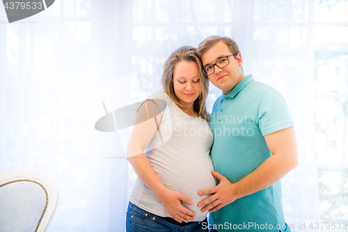 Image of Beautiful couple: pregnant woman and man