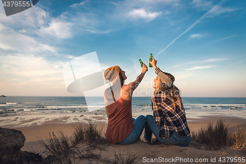 Image of Making a toast on the beach