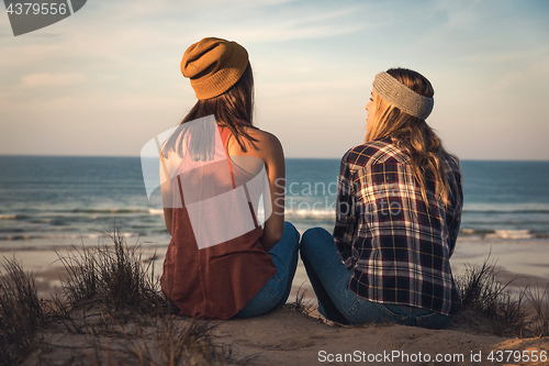 Image of Girls sitting on the beach