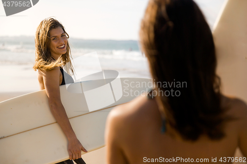 Image of Girls ready for surfing