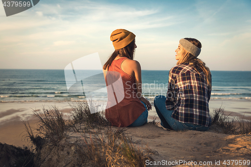 Image of Girls sitting on the beach