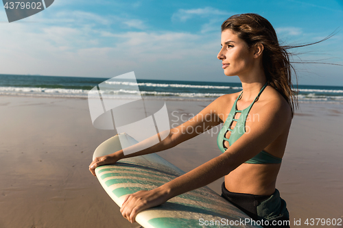 Image of Beautiful surfer girl
