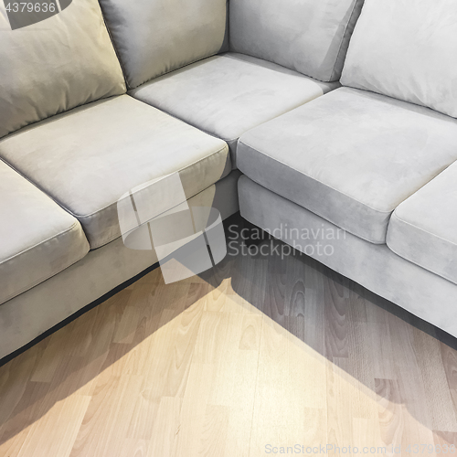 Image of Corner gray velvet sofa