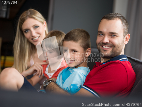 Image of young cuple spending time with kids